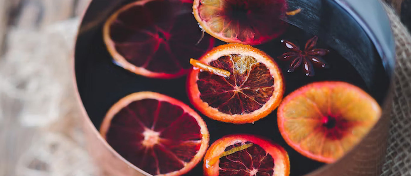 pot of mulled wine with oranges